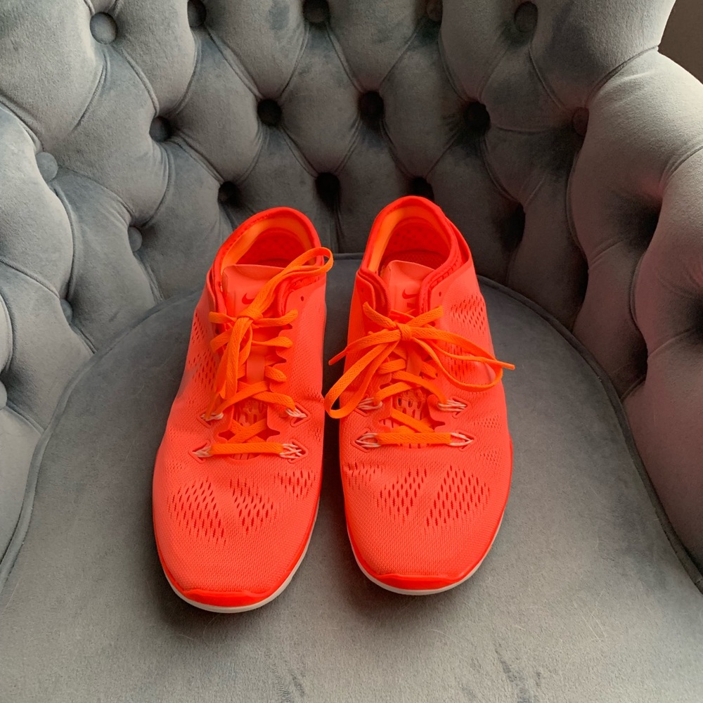 Neon pink Nike shoes